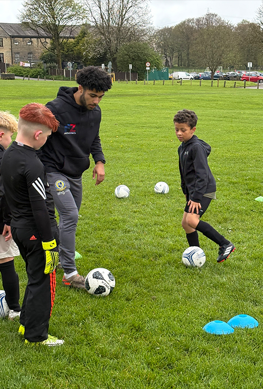 Players taking part in a football camp session.